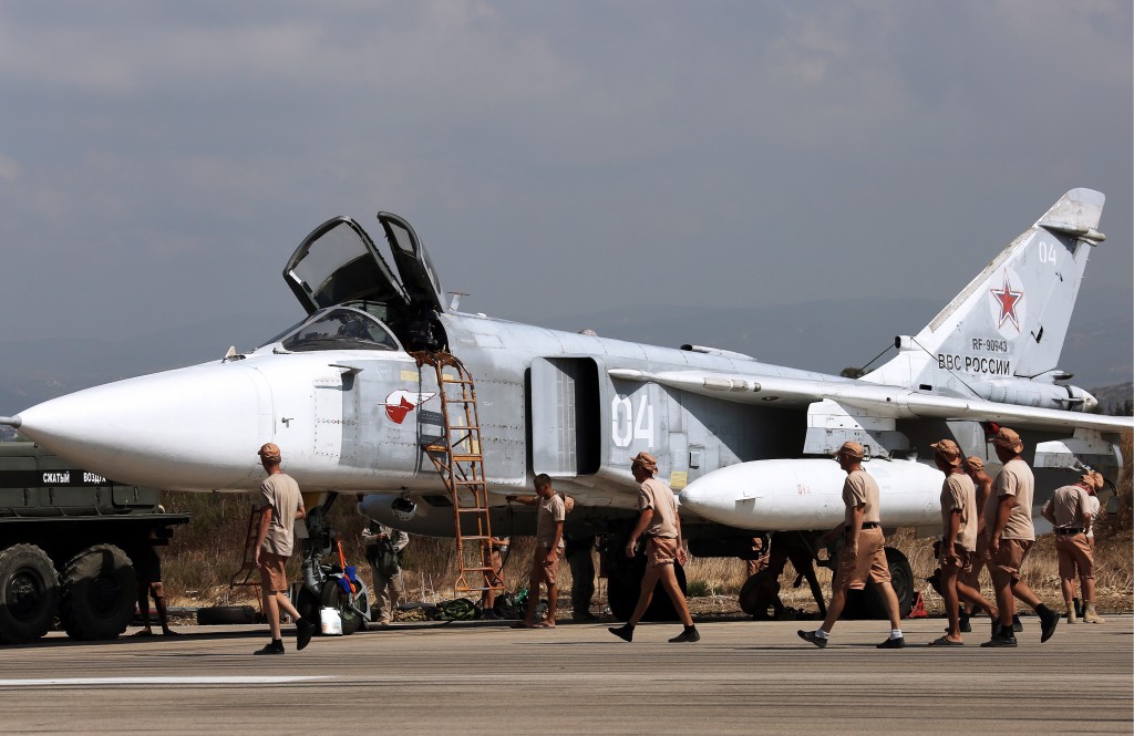 LATAKIA, SYRIA. OCTOBER 4, 2015. Russia's Sukhoi Su-24 attack aircraft at the Hmeymim airbase. TASS Ñèðèÿ. Ëàòàêèÿ. 4 îêòÿáðÿ 2015. Ðîññèéñêèé ôðîíòîâîé áîìáàðäèðîâùèê Ñó-24Ì íà àâèàáàçå "Õìåéìèì". ÒÀÑÑ